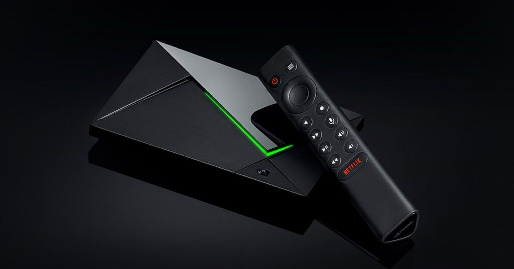 A product shot of the Nvidia Shield TV Pro streaming device and its remote control