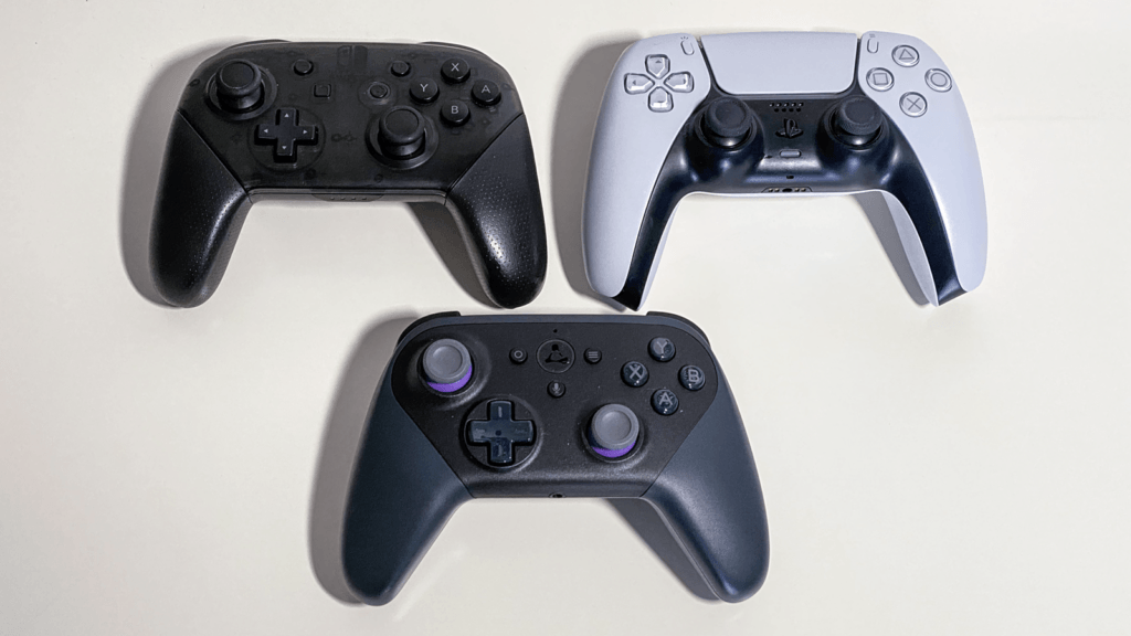 Comparison of the Luna controller alongside the Nintendo Switch Pro and Sony DualSense 5 controllers
